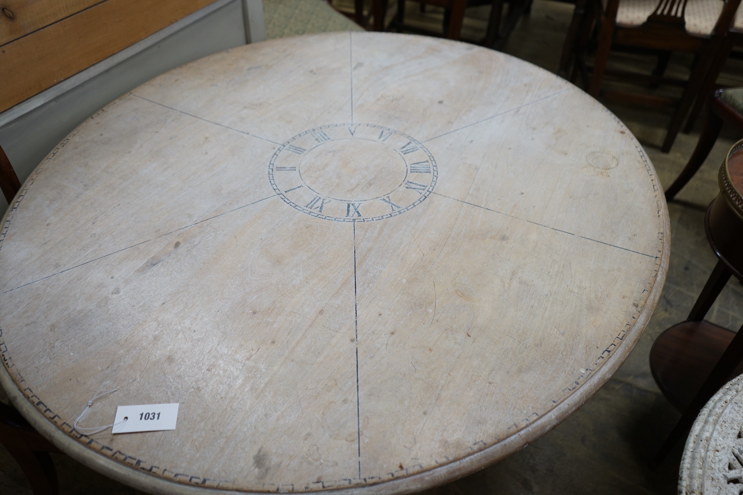 A Victorian style circular painted pine circular dining table on painted cast metal base, diameter 125cm, height 73cm